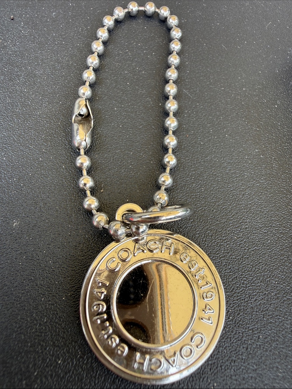 Coach Silver-Tone Round Logo Disc Necklace